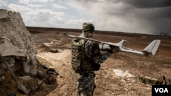 Deaf protesters wearing white gloves raise up their hands during an anti-government rally in central Athens. Organizations representing the disabled and people with chronic diseases traveled from across Greece to join the rally against austerity measures linked to the country&#39;s international bailout.