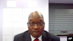 In this Frame grab former South Africa President Jacob Zuma, appears on a screen virtually from the correctional service facility Estcourt, in Pietermaritzburg, South Africa, July 19, 2021.