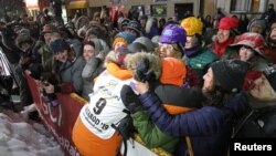 Pete Kaiser of of Bethel, Alaska embraces fans from his hometown after winning the Iditarod Trail Sled Dog Race after crossing the finish line in Nome, Alaska, U.S. March 13, 2019. (REUTERS/Diana Haecker/Nome Nugget)