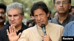 FILE - Pakistan Tehreek-e-Insaf party leader Imran Khan talks to media in Islamabad, Pakistan, Nov. 1, 2016. Khan took part in a gathering Thursday praising a massive government-run reforestation campaign that has grown 750 million trees across a northwestern province since 2015.