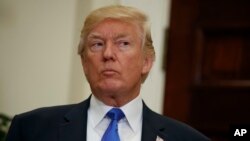 President Donald Trump listens in the Roosevelt Room of the White House in Washington, Aug. 2, 2017.