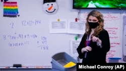 Grace Kern is working a substitute teacher at the Greenfield Intermediate School in Greenfield, Indiana. (AP Photo/Michael Conroy)