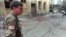 FILE - Lt. Col. Charles Vuckovic Defense Attache of the U.S. embassy in Sarajevo visits the location of the mortar impact near a market place in downtown Sarajevo, Aug. 28, 1995.