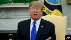 President Donald Trump speaks in the Oval Office of the White House, Feb. 13, 2019.