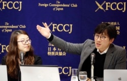 FILE - Plaintiffs' attorneys Lim Jae-sung, right, speaks as Kim Se-eun listens during a press conference in Tokyo, Dec. 4, 2018. Lawyers for South Koreans forced into wartime labor have taken legal steps to seize the South Korean assets of a Japanese company.