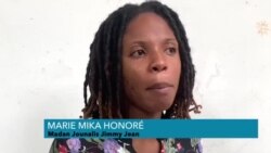 Madanm Youn nan Jounalis ki Mouri nan Atak Gang 24 Desanm lan Kritike Fason yo Jere Lantèman Mari l