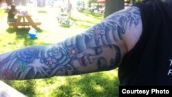 Melissa Thomas, IT specialist in Washington, D.C. and her Japanese theater mask tattoo. 