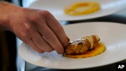 Chef Zach Tyndall prepares Good Meat's cultivated chicken at the Eat Just office in Alameda, California, June 14, 2023.(AP Photo/Jeff Chiu)
