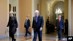 Senate Majority Leader Mitch McConnell of Ky. walks to the Senate chamber on Capitol Hill in Washington, Tuesday, March 24, 2020.