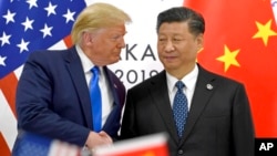 Donald Tramp i Ši Đinping tokom junskog susreta u Osaki, arhivska fotografija (Foto: AP/Susan Walsh)