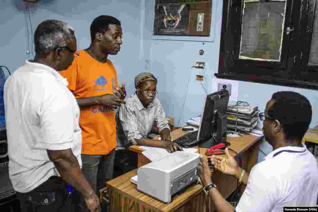 School manager Hala on her desk, along with other two school teachers on the left, as they give feedback to one of the student's father, Sept. 16, 2017, Cairo, Egypt.