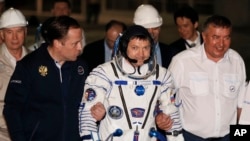 Manned Soyuz Capsule Reaches Space Station 