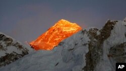FILE - In this Nov. 12, 2015, file photo, Mt. Everest is seen from the way to Kalapatthar in Nepal. China will draw a “separation line” atop Mount Everest to prevent the coronavirus from being spread by climbers ascending Nepal's side of the mountain,…