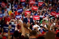 FILE - President Donald Trump reacts to the crowd after speaking during his reelection kickoff rally at the Amway Center, June 18, 2019, in Orlando, Fla.