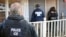 FILE - U.S. Immigration and Customs Enforcement, ICE agents at a home in Atlanta, Georgia.