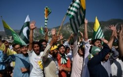 Pakistani Kashmiri shout slogans as they listen to Pakistan's Prime Minister Imran Khan during a rally in Muzaffarabad, Sept. 13, 2019.