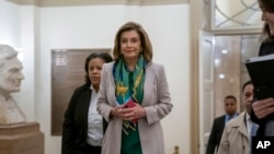 Speaker of the House Nancy Pelosi, who has not yet relayed the articles of impeachment to the Senate for the trial of President Trump, arrives to meet with the Democratic Caucus at the Capitol in Washington, Jan. 14, 2020. 