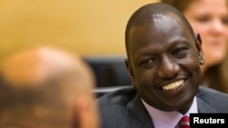 FILE - Kenyan Deputy President William Ruto speaks to his attorney at the International Criminal Court in The Hague, Sept. 10, 2013.
