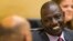 FILE - Kenyan Deputy President William Ruto speaks to his attorney at the International Criminal Court in The Hague, Sept. 10, 2013.