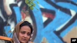 In this Oct. 9, 2015 photo, Parisa Aimaq, an Afghan female reporter for privately-owned Khawar Television, talks during an interview with The Associated Press at the Afghan Journalists' Safety Committee in Kabul. 