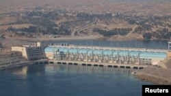 FILE - A general view shows the Tishrin Dam, south of Kobani, Syria, Dec. 27, 2015.