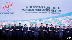 FILE - ASEAN foreign ministers pose for group photo in Kuala Lumpur, Malaysia, Aug. 6, 2015. 