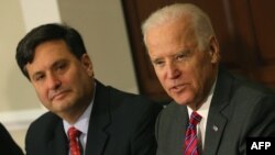 (FILES) In this file photo taken on November 13, 2014 US Vice President Joseph Biden (R) joined by Ebola Response Coordinator Ron Klain (L), speaks during a meeting regarding Ebola at the Eisenhower Executive office building in Washington, D.C. 