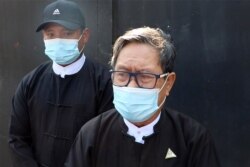 In this image taken from video, Khin Maung Zaw, who represents detained civilian leader Aung San Suu Kyi, speaks to journalists outside the Zabu Thiri District Court in Naypyitaw, Myanmar, Feb. 16, 2021.