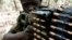 FILE - A Ugandan soldier tracking down Lord's Resistance Army (LRA) fugitive leaders takes position behind a machine gun at a forest bordering Central African Republic, South Sudan and Democratic Republic of Congo, near the Chinko River.