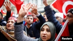 People shout slogans during a protest in front of the Dutch Consulate in Istanbul, Turkey, March 12, 2017. 