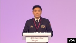 French soldiers of the Commando Hubert carry the flag-draped coffins during a national ceremony at the National Invalides Hotel in Paris, of the two French marine soldiers, Cedric de Pierrepont and Alain Bertoncello, killed during a hostage-rescue operation in Burkina Faso.