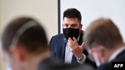 FILE - Leonid Volkov, chief strategist for prominent Kremlin critic Alexey Navalny, speaks during a press conference at the Lithuanian Embassy in Brussels, Belgium, Feb. 22, 2021. 