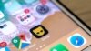 This from March 27, 2019, shows the Grindr icon on a phone. This week, the Committee for Investment in the United States reportedly directed Beijing Kunlun Tech to divest itself of Grindr, a gay dating app, because of concern the data it collects could be used for blackmail.