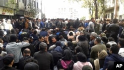 Protesters attend a demonstration after authorities raised gasoline prices, in the northern city of Sari, Iran, Nov. 16, 2019.