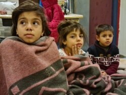 20200319_140553: Omar's children are sick, but there is no available health care at the bus station where they are staying after trying to cross into Greece, pictured on March 19, 2020 in Istanbul. (Heather Murdock/VOA)