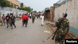 FILE - A soldier patrols the streets after a grenade attack in Burundi's capital, Bujumbura, Feb. 3, 2016. Burundi has been plagued by violence since President Pierre Nkurunziza ran for a controversial third term last year.