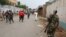FILE - A soldier patrols the streets after a grenade attack of Burundi's capital Bujumbura, Feb. 3, 2016. The East African Community (EAC), meeting in Arusha, Tanzania Wednesday named the 77-year old Mkapa to hopefully breed new life into talks.
