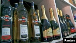 File - Bottles of alcohol are displayed in a liquor shop at Wuse Market in Abuja, Nigeria.