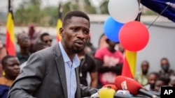 FILE - Ugandan opposition figure Bobi Wine, whose real name is Robert Kyagulanyi, speaks at a press conference in Kampala, Uganda, Feb. 22, 2021.