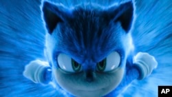 ຮູບພາບທີ່ໄດ້ຮັບການເຜີຍແຜ່ໂດຍ Paramount Pictures ແລະ Sega of America ນີ້, ສະແດງໃຫ້ເຫັນທ່າທາງຂອງ Sonic ໃນສາກຂອງຮູບເງົາ "Sonic the Hedgehog 3." (Paramount Pictures and Sega of America, Inc. via AP)