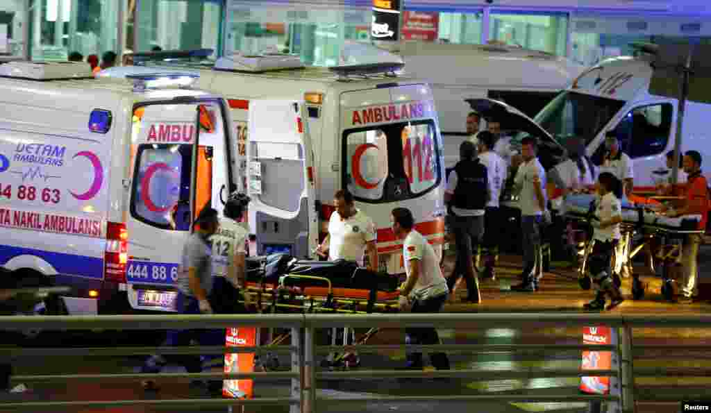 Paramedics push a stretcher at Turkey's largest airport, Istanbul Ataturk, following a blast in Turkey, June 28, 2016. 