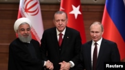 Predsednici Irana, Turske i Rusije - Hasan Rohani, Redžep Tajip Erdogan i Vladmir Putin tokom sastanka u Ankari, 4. april 2018.