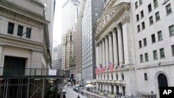 FILE - The New York Stock Exchange is pictured, Nov. 23, 2020. U.S. stocks finished higher on Jan. 8, 2021, despite a sober reminder of how many jobs the pandemic has eliminated. 