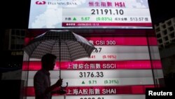People eat inside a flood relief camp on an island in Howrah district, West Bengal, India.