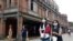 People wearing face masks to help curb the spread of the coronavirus walk on a street in Taipei, Taiwan, Monday, Oct. 19, 2020. (AP Photo/Chiang Ying-ying)