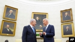FILE - President Joe Biden, right, talks with Israeli Prime Minister Benjamin Netanyahu in the Oval Office of the White House in Washington, July 25, 2024.