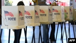 Citizens vote on Election Day at a fire station in Alhambra, Los Angeles County, California, Nov. 6, 2012.