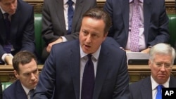 British Prime Minister David Cameron talks to lawmakers inside the House of Commons in London, Dec. 2, 2015. 