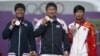 Silver medalist Japan's Takaharu Furukawa (L to R), gold medalist South Korea's Oh Jin Hyek and bronze medalist China's Dai Xiaoxiang pose during the victory ceremony for the men's individual archery event at the London 2012 Olympic Games at the Lord's C