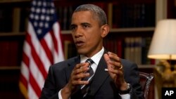 FILE - President Barack Obama speaks during an interview at the White House.